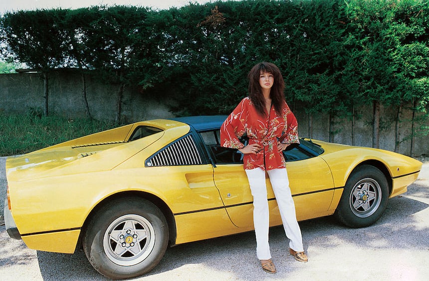 Kate Bush with a Ferrari car
